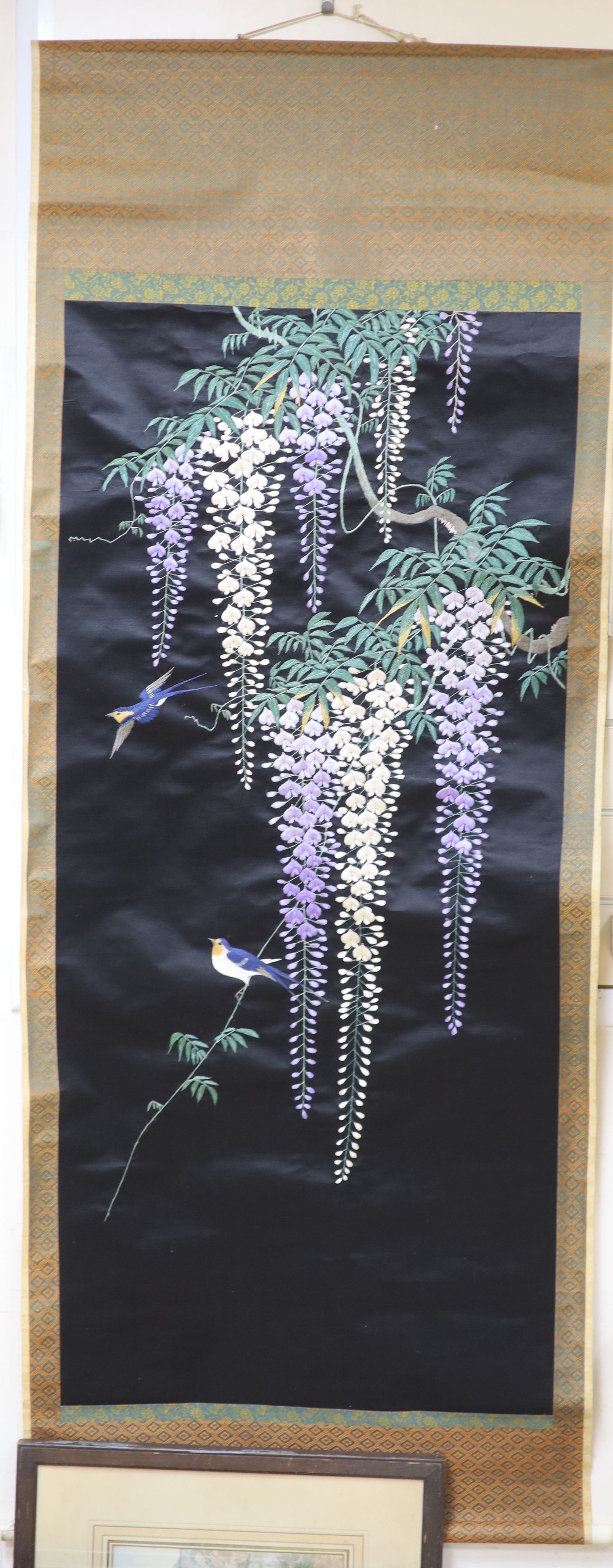 A Japanese embroidered wisteria hanging scroll, overall length 170cm